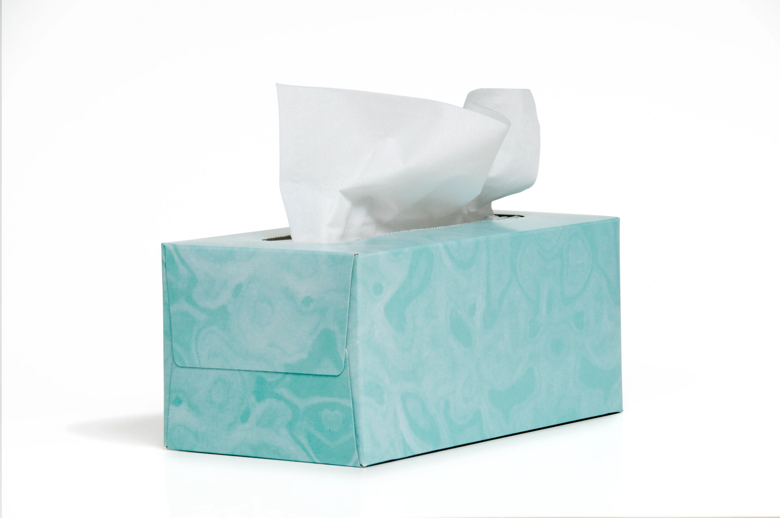A box of soft facial tissues with one tissue pulled out.